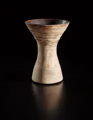 Small-waisted form by Hans Coper, circa 1958, Stoneware, layered white porcelain slips and engobes over a body with textured and incised linear designs, the interior , sold Oct 2018