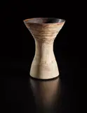 Small-waisted form by Hans Coper, circa 1958, Stoneware, layered white porcelain slips and engobes over a body with textured and incised linear designs, the interior , sold Oct 2018