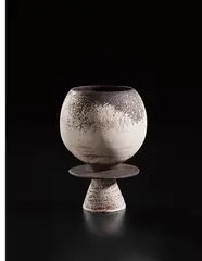 Composite pot on foot with central disc by Hans Coper, circa 1974, Stoneware, layered white porcelain slips and engobes over a body with textured and incised linear designs, the interior , sold Oct 2018