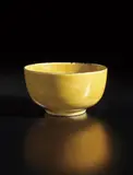 Wide-footed bowl by Lucie Rie, circa 1968, Stoneware, mustard-yellow glaze, manganese rim, offered Oct 2018