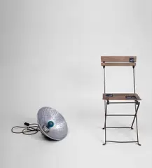 Marcel Broodthaers, Lampe Bleu et Chaise, 1969, photographic lamp with blue bulb, metal reflector, chair and black paper