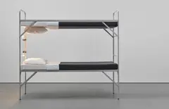 Elmgreen & Dragset, Boy Scout, 2008, metal bunk bed, foam mattresses, sheeting, pillows, woollen blankets, light bulbs and electrical wiring