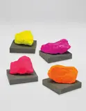 4 works: (i) Small Yellow Mountain; (ii) Small Pink Mountain; (iii) Small Orange Mountain; (iv) Small Violet Mountain by Ugo Rondinone, 2016, (i - iv) painted stone on concrete base, each in 2 parts, sold Oct 2017