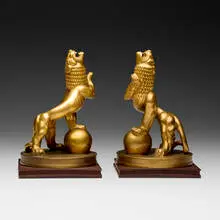 Carl Milles, Heraldic lions, pair, gilt bronze, wood