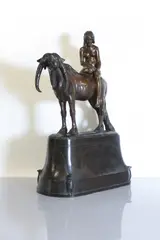 Hermann Haase-Ilsenburg, Hermann Haase-Ilsenburg (German, 1879, a patinated bronze group of a young girl seated on the back of a long-horned cow
