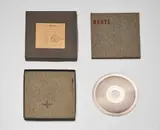 Joseph Beuys, Sun Disc, 1973, Record matrix (nickel-plated copper) with die-cut hole, felt pads stamped with brown paint, contained in original cardboard box