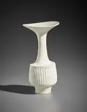 Vase with flaring lip and vertically fluted body by Lucie Rie, 1976, Porcelain, white glaze, sold Apr 2017