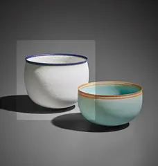 Bowl by Alev Ebüzziya Siesbye, 1991, Stoneware, matt white glaze with occasional blue speckles, an unglazed band and a cobalt glaze lip, sold Apr 2017