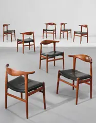 Hans J. Wegner, Set of eight 'Cowhorn' chairs, model no. JH 505, circa 1952, Teak, rosewood inlays, leather