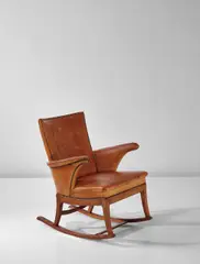 Rocking chair by Frits Henningsen, circa 1930, Cuban mahogany, Niger leather, brass nailheads, sold Apr 2017