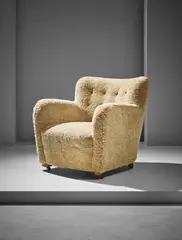 'Third' armchair by Flemming Lassen, circa 1935, Sheepskin, Cuban mahogany, bronze and Bakelite casters, sold Apr 2017