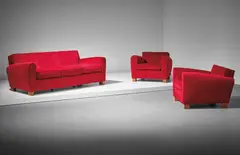 Jean Royere, Sofa and pair of armchairs, circa 1949, Oak, fabric