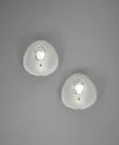 Max Ingrand, Pair of wall lights, model no. 1944, circa 1958, Partially frosted and chiselled glass, tubular brass, brass, painted metal