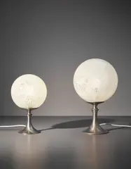 Two table lamps by Venini, circa 1950, Clear and lattimo murrine glass, nickel-plated metal, sold Sep 2017