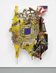 Elliott Hundley, O Dika, 2007, wood, sound board, Styrofoam, plastic, wax, paper, string, glitter, wire, silk, acrylic paint, canvas, tin, pins, feathers, animal claws, metal brackets, wheel