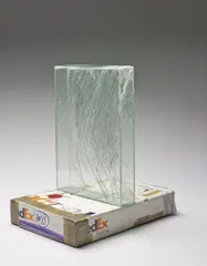 SSCC 139751 REV 10/05 "FedEx Large Box", Priority Overnight" by Walead Beshty, 2007, glass, silicone, metal, FedEx shipping box, packing tape, and accrued FedEx tracking labels, sold Jun 2016