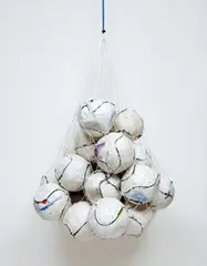 Mark Bradford, Soccer Ball Bag 1, 2011, nylon string and paper on soccer balls