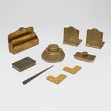 Zodiac nine-piece desk set by Tiffany Studios, c. 1915, gilt bronze, gilt and acid-etched bronze, glass, sold Nov 2025