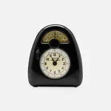 Isamu Noguchi, Measured Time clock and kitchen timer, c. 1932, Bakelite, glass, printed paper