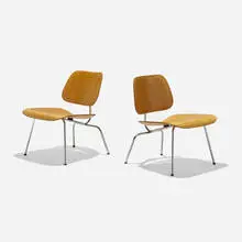 Early LCMs, pair by Charles and Ray Eames, molded ash plywood, chrome-plated steel, rubber, sold Sep 2024