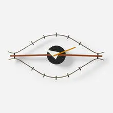 Eye wall clock, model 2238 by George Nelson & Associates, 1957, enameled steel, brass, enameled aluminum, walnut, lacquered wood, sold Sep 2024