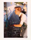 William Eggleston, Untitled (Supermarket Boy with Carts)