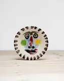 Visage no. 202 (Face no. 202) by Pablo Picasso, 1963, White earthenware round dish, painted in colours, with brushed glaze,, sold Jun 2016