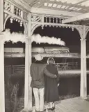 O. Winston Link, Mr. and Mrs. Pope watch the last steam powered passenger train, Max Meadows, Virginia