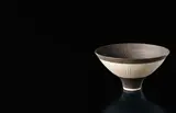 Conical bowl by Lucie Rie, circa 1976, Porcelain, golden manganese glaze, radiating inlaid and sgraffito design, sold Apr 2016