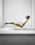 Early and rare 'Grasshopper' chaise longue, model no. FK87, with cane seat by Preben Fabricius and Jørgen Kastholm, designed 1968, Chromium-plated stainless steel, cane, leather, sheepskin, offered Apr 2016