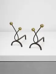 Pair of 'Boules' andirons by Jean Royere, circa 1950, Patinated steel, brass, sold Sep 2016
