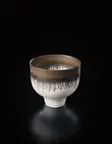 Small bowl by Lucie Rie, 1974, Porcelain, matte white glaze with golden manganese lip, sold Sep 2016