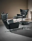 Arne Jacobsen, Pair of 'Ox' armchairs and ottomans, 1971, Leather, chromium-plated metal, painted steel