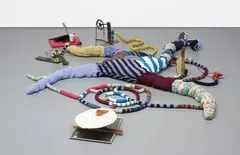 John Bock, Diagram Under, 2007, wood, clothes peg, paper cup, bicycle chain, brakes and cogs, egg shell, plastic business card box, metal springs, metal plate, wax, soup tin, elasticated waste band, glass bottle of Sjanovil, copper, glazed picture frame, milk carton, wire, sequinned, knitted and stuffed material