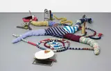 John Bock, Diagram Under, 2007, wood, clothes peg, paper cup, bicycle chain, brakes and cogs, egg shell, plastic business card box, metal springs, metal plate, wax, soup tin, elasticated waste band, glass bottle of Sjanovil, copper, glazed picture frame, milk carton, wire, sequinned, knitted and stuffed material