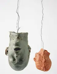 Bruce Nauman, Hanging Heads # 1 (Blue Andrew, Mouth Open / Red Julie with Cap), 1989, wax, wood, wire, in two parts