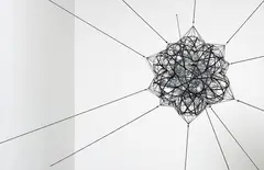 Tomás Saraceno, Flying Garden/Air-Port-City/12SW, 2007, 12 inflatable PVC pillows, net, elastic rope