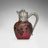 Syrup pitcher with fruiting grapevines by Daum, c. 1900, acid-etched and gilt cameo glass, silver, parcel-gilt silver, sold Nov 2025