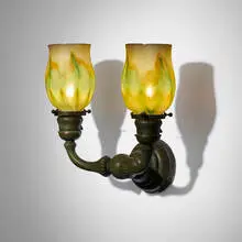 Two-arm sconce with pulled-feather shades by Tiffany Studios, c. 1910, hand-blown Favrile glass, patinated bronze, sold Nov 2025