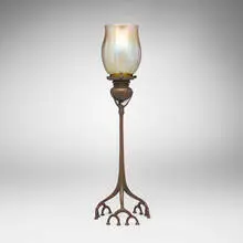 Root candlestick with shade by Tiffany Studios, c. 1905, patinated and acid-etched bronze, hand-blown Favrile glass, sold Nov 2025