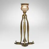 Candlestick with snuffer by Tiffany Studios, c. 1905, gilt bronze, gilt and acid-etched bronze, hand-blown Favrile glass, sold Nov 2025