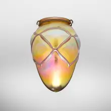 Decorated stalactite shade by Tiffany Studios, c. 1900, hand-blown Favrile glass, patinated bronze, sold Nov 2025