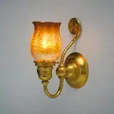 Wave wall sconce by Tiffany Studios, c. 1910, gilt bronze, hand-blown Favrile glass, sold Nov 2025