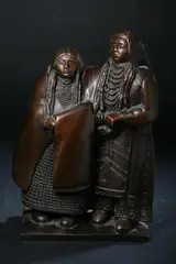 Two Native American Figures by Doug Hyde, Bronze with dark golden brown patina - Height: 17 in, sold May 2012