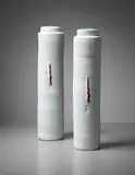Pair of lidded vessels by Edmund de Waal, 1996, Porcelain, celadon and red glazes over impressed designs in the body, sold Apr 2015