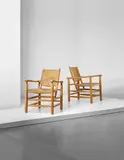 Charlotte Perriand, Pair of armchairs, model no. 21, from 'L’Equipement de la Maison' series, Grenoble