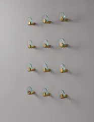 Set of twelve wall-mounted coat hangers by Fontana Arte, circa 1960, Glass, brass, sold Apr 2015