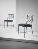 Jean Royere, Pair of 'Croisillon' side chairs, circa 1950, Painted tubular metal, painted metal, fabric