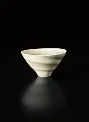 Conical bowl by Lucie Rie, circa 1972, Mixed clays producing an integral colour spiral, sold Oct 2015