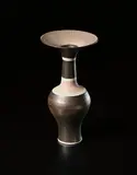 Vase with flaring lip by Lucie Rie, circa 1976, Porcelain, golden manganese glaze, dry terracotta shoulder and lip, with radiating sgraffito design, three bands of blue, sold Oct 2015